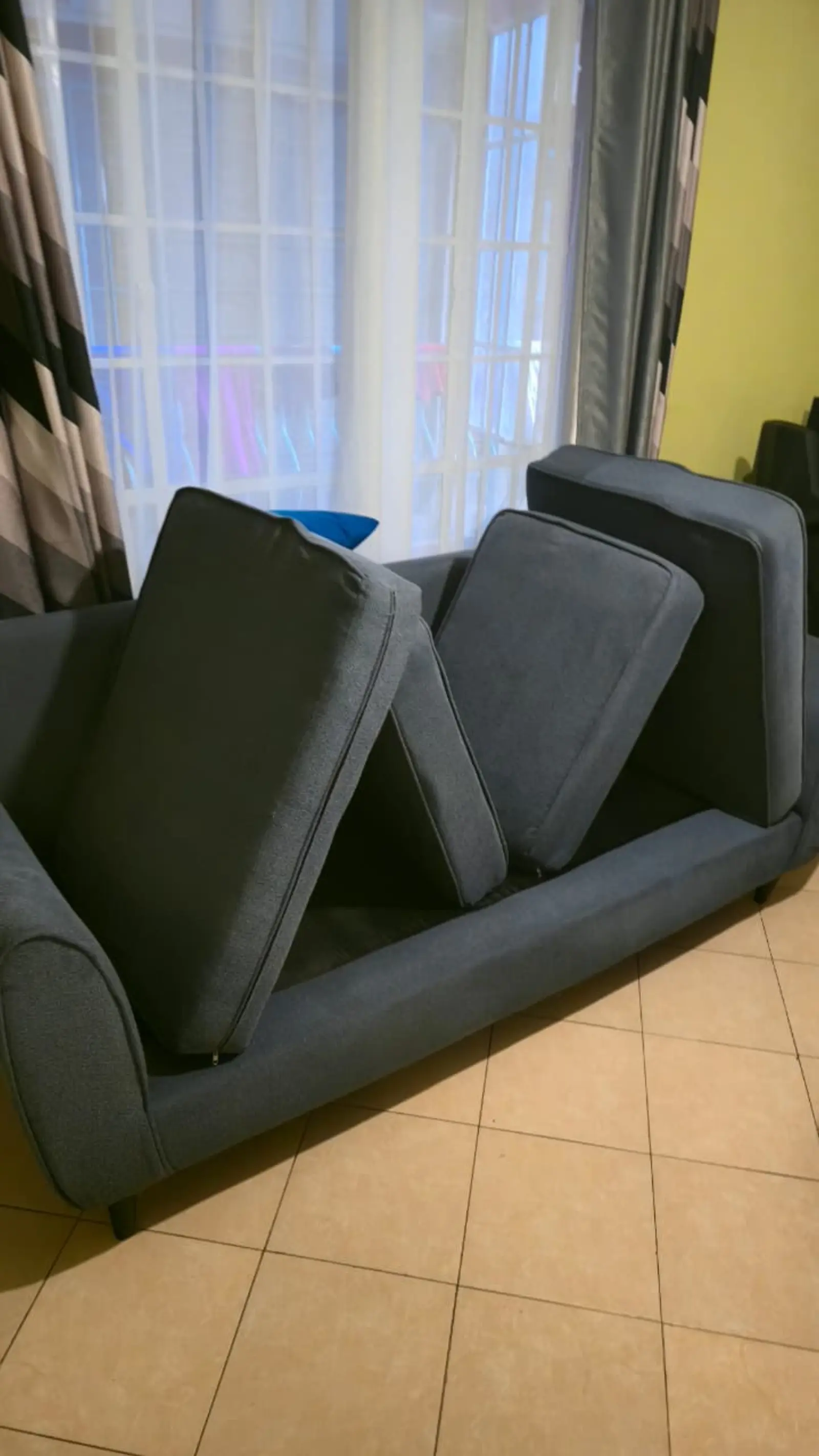 Sofa cushions stacked and drying after extraction